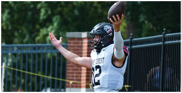 A man wearing a white jersey with the number 2 on it. Description generated by AI