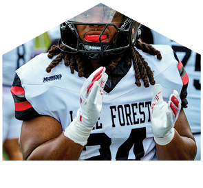 A football player wearing a helmet and a white jersey with the number 31 on it. Description generated by AI