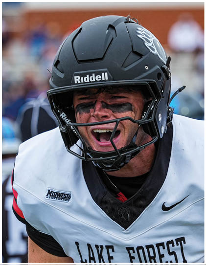 A football player running on the field. Description generated by AI