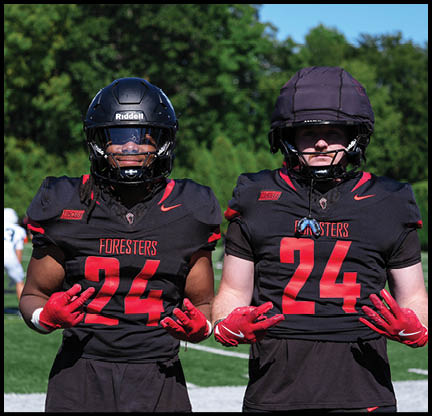 A group of football players posing for a picture. Description generated by AI
