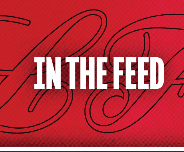 A black and red sign with the words “in the feed" written in white. Description generated by AI