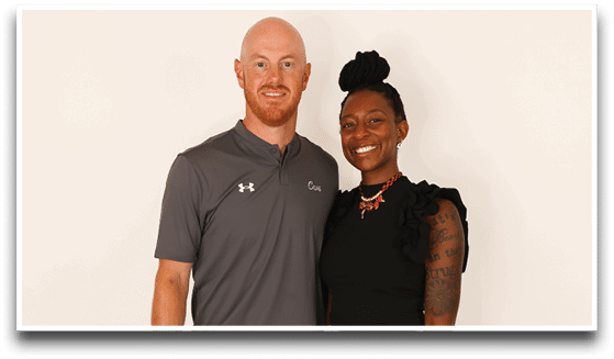Three adults wearing football jerseys with the number 3 pose smiling against a dark background, with one holding a football. Description generated by AI