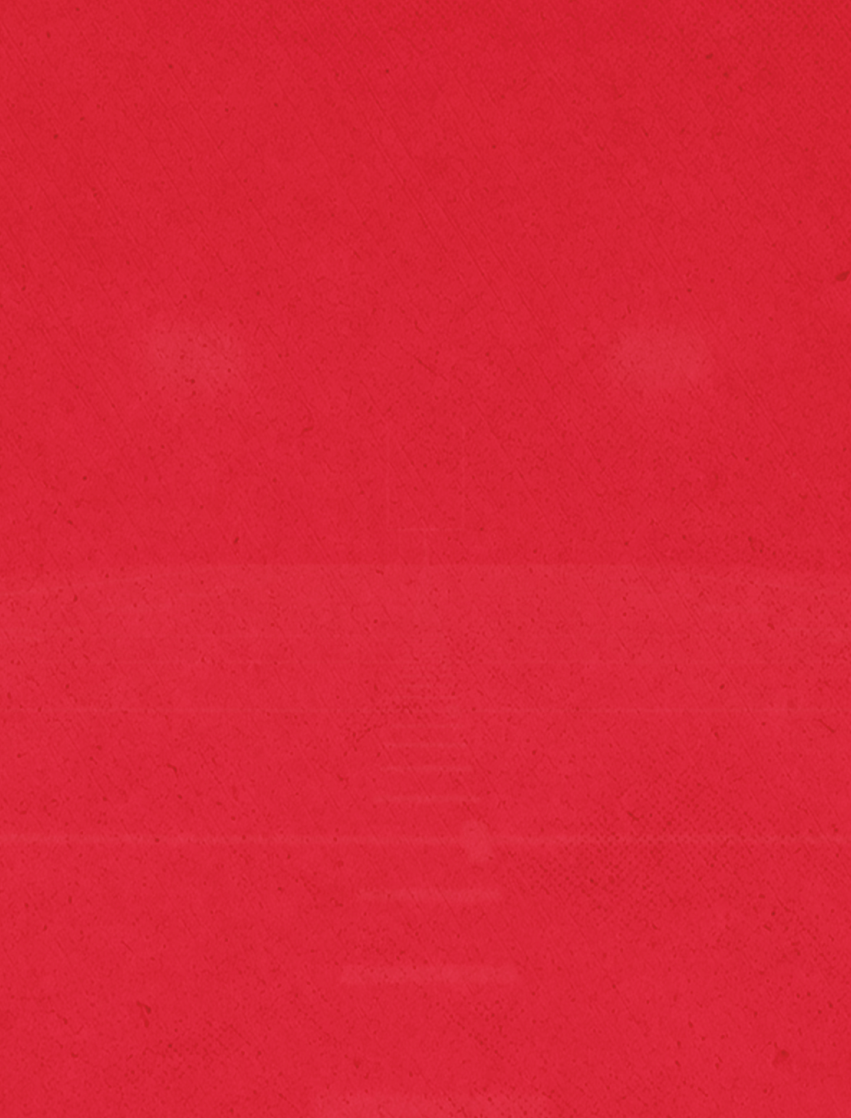 A person wearing a red jacket and black pants is walking on a snowy path in a forest with tall trees. Description generated by AI