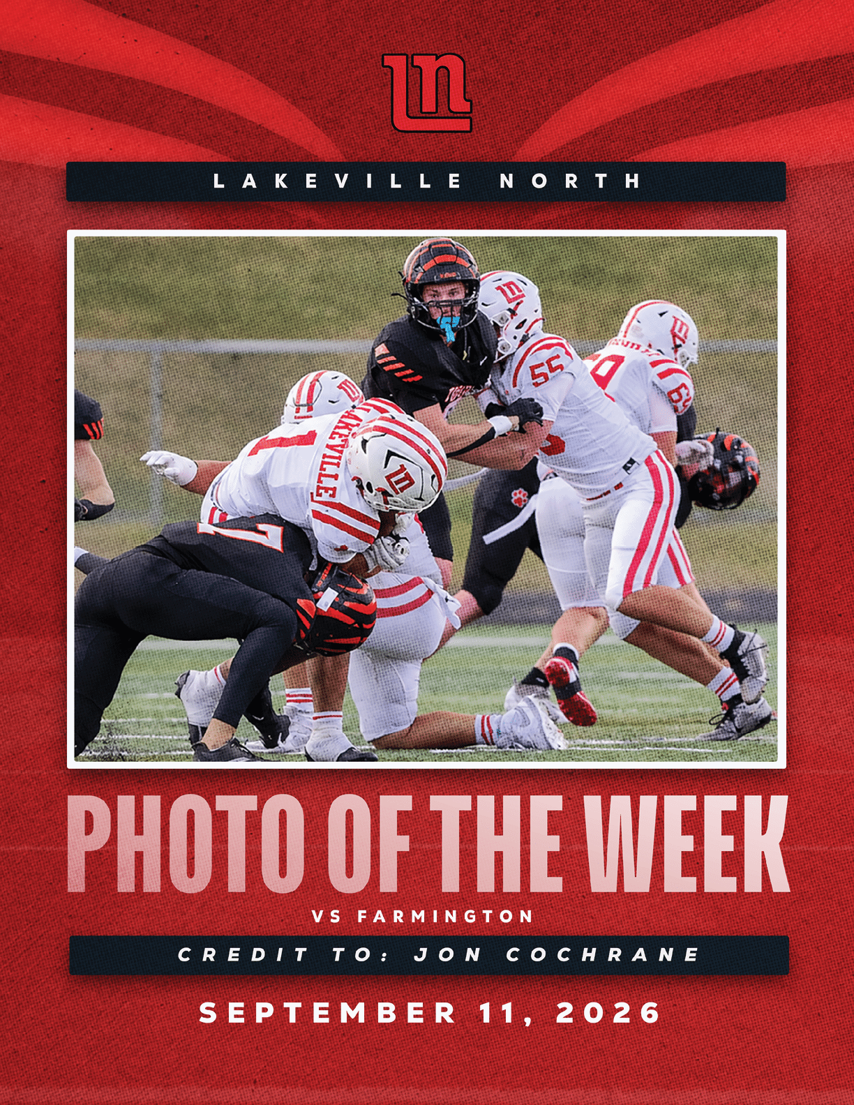 A group of football players in action on a field with some players in white and red uniforms tackling a player in a black uniform, framed by a red graphic background with text indicating a Lakeville North versus Farmington game and the date September 11, 2026. Description generated by AI