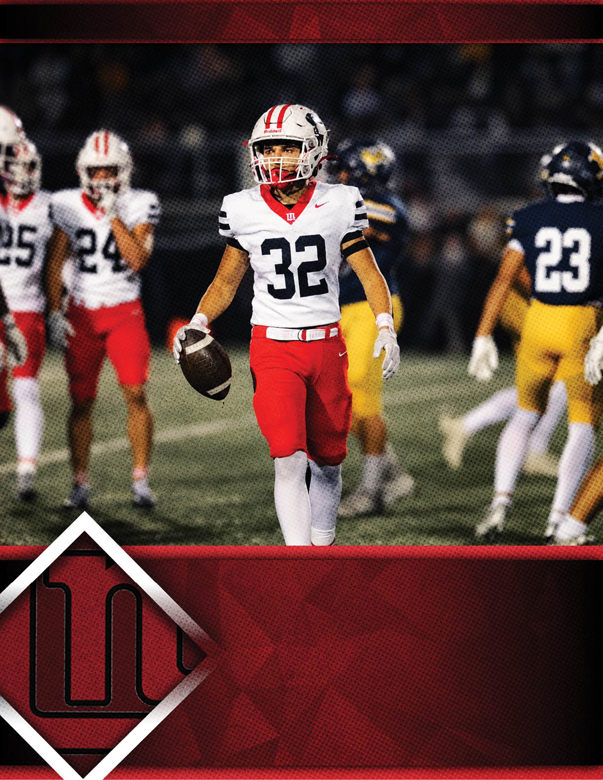 A person wearing a white football jersey with the number 32 and red pants is holding a football on a field with other players in the background. Description generated by AI
