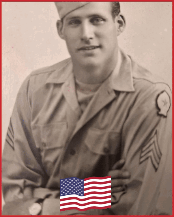 A person wearing a vintage military uniform with sergeant stripes on the sleeves and a cap is sitting with arms crossed. Description generated by AI