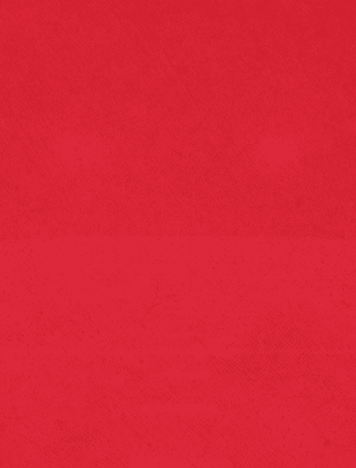 A person wearing a red jacket and black pants is walking on a snowy path in a forest with tall trees. Description generated by AI
