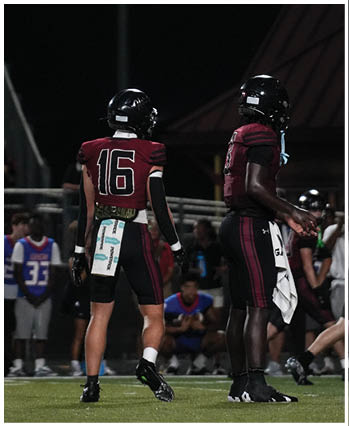 A group of football players celebrating a touchdown. Description generated by AI