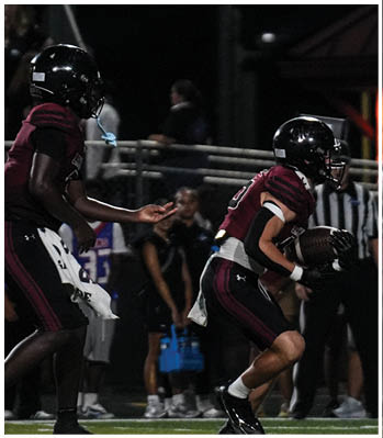 A group of football players celebrating a touchdown. Description generated by AI