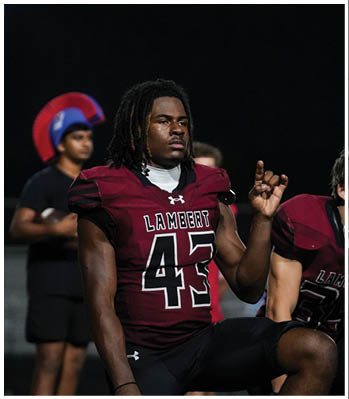 A group of football players celebrating a touchdown. Description generated by AI