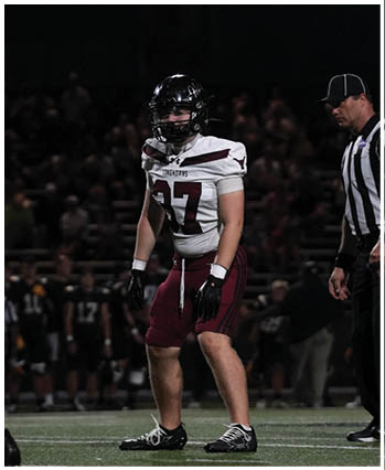 A group of football players celebrating a touchdown. Description generated by AI