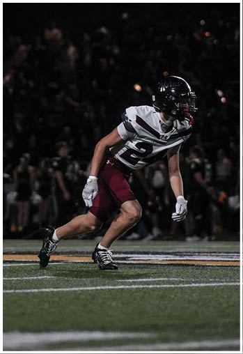 A group of football players celebrating a touchdown. Description generated by AI