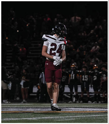 A group of football players celebrating a touchdown. Description generated by AI