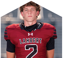 A young man wearing a white jersey with the number 10 on it. Description generated by AI