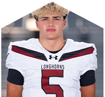 A young man wearing a white jersey with the number 10 on it. Description generated by AI