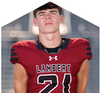 A young man wearing a white jersey with the number 10 on it. Description generated by AI