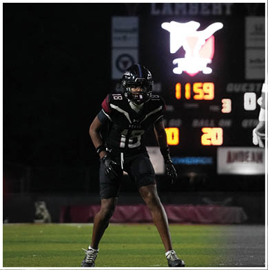 A football player running on the field. Description generated by AI