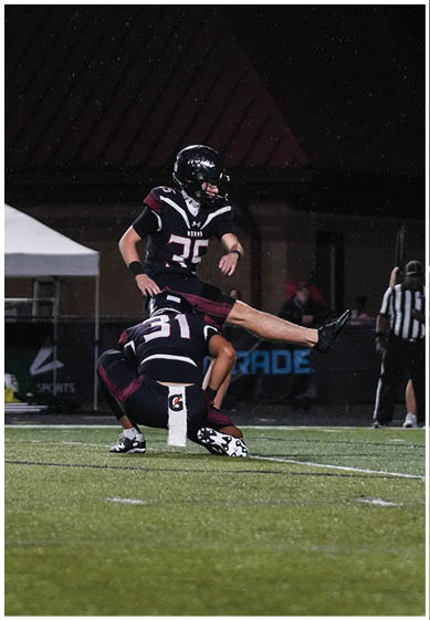 A football player wearing a blue jersey with the number 58 on it. Description generated by AI