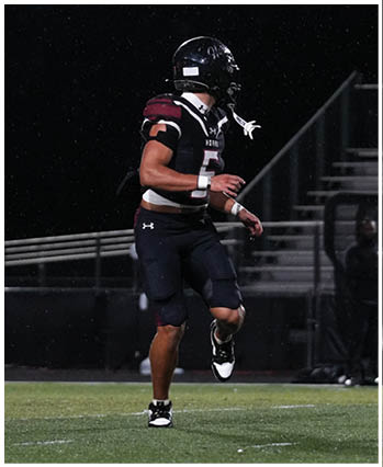 A group of football players celebrating a touchdown. Description generated by AI