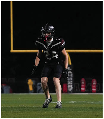 A group of football players celebrating a touchdown. Description generated by AI