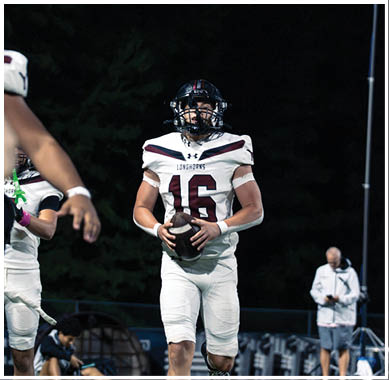 A football player wearing a blue jersey with the number 58 on it. Description generated by AI