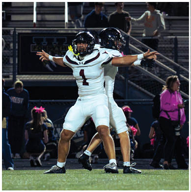 A football player running on the field. Description generated by AI
