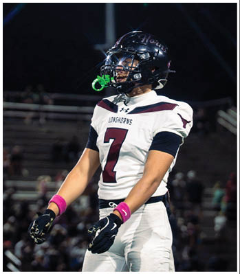A group of football players celebrating a touchdown. Description generated by AI