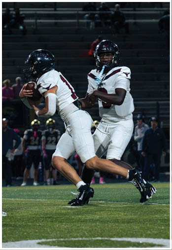 A group of football players celebrating a touchdown. Description generated by AI