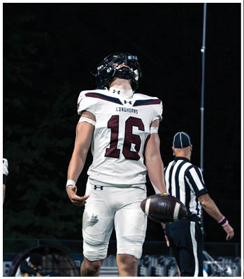 A group of football players celebrating a touchdown. Description generated by AI