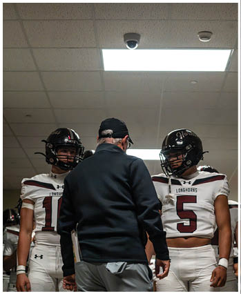 A group of football players celebrating a touchdown. Description generated by AI
