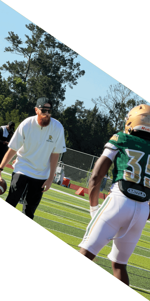 Two men are jumping in the air on a field, both wearing football uniforms. AI generated content
