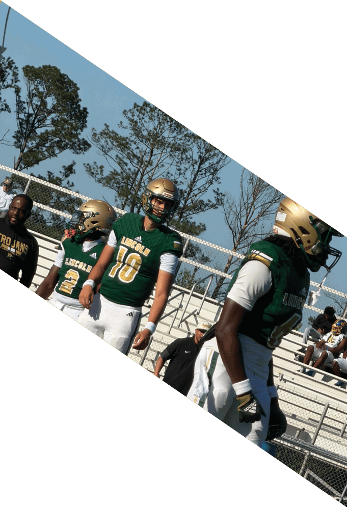 Four football players pose for a picture on the field. AI generated content