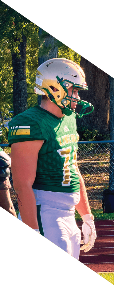 A football player wearing a helmet and white uniform is holding his helmet above his head. AI generated content