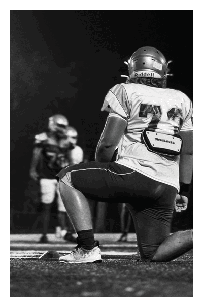 A football player wearing a black and white uniform with the number 10 on the back. AI generated content