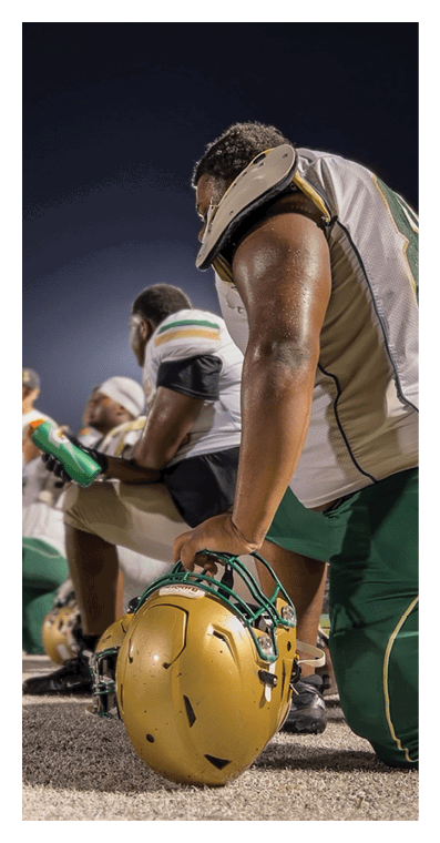A football player in a white jersey with the number 85 on it is trying to catch a football. AI generated content