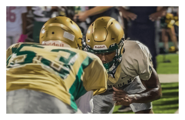A group of football players wearing headphones and smiling. AI generated content
