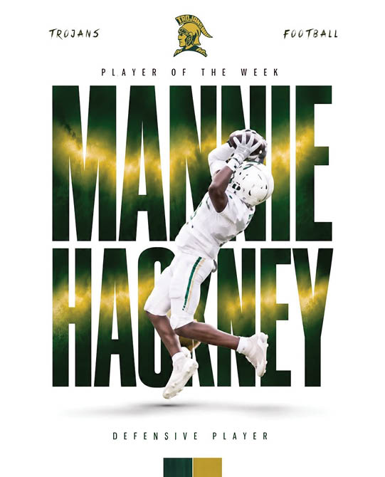 A person in white football gear is jumping and catching a football in front of large green and yellow text that reads “Mannie Hackney" with "Player of the Week" and "Trojans Football" written above. Description generated by AI