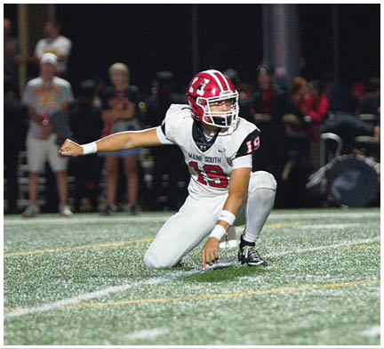 A football player running on the field. Description generated by AI