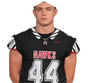 A young man wearing a white jersey with the number 10 on it. Description generated by AI