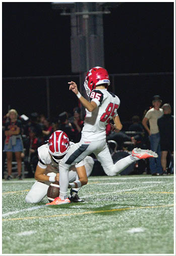 A football player running on the field. Description generated by AI