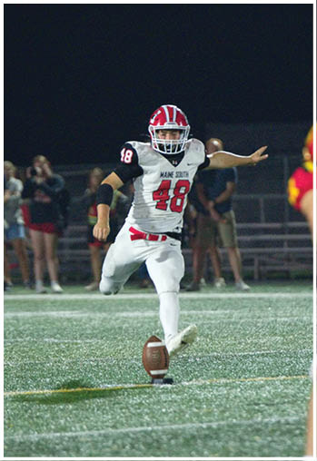 A football player running on the field. Description generated by AI