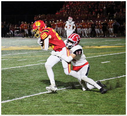 A football player running on the field. Description generated by AI