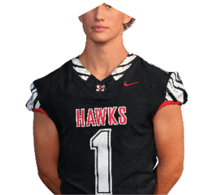 A young man wearing a white jersey with the number 10 on it. Description generated by AI