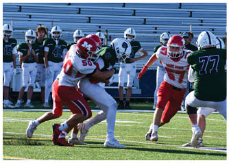 A group of football players on a field. Description generated by AI