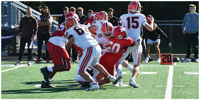 A group of people wearing football uniforms are engaged in a play on a grassy field with a down marker showing the number 20 nearby. Description generated by AI