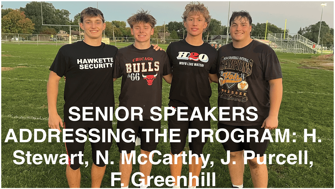 Four people standing on grass wearing shorts and athletic shoes with text above them listing senior speakers addressing a program. Description generated by AI