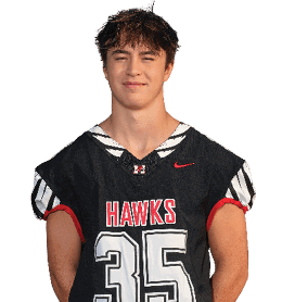 A person with short tousled hair is standing and wearing a black sports jersey with red and white accents that says “HAWKS" and the number 35. Description generated by AI