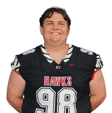 A person with short hair is smiling and wearing a black football jersey with the number 98 and the word “HAWKS" on the front. Description generated by AI
