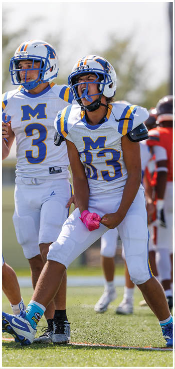 A football player running on the field. Description generated by AI