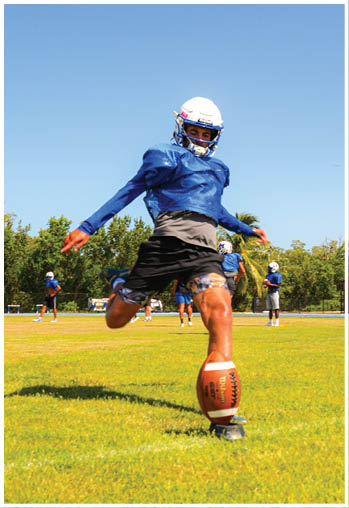 A football player running on the field. Description generated by AI